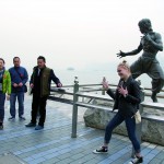 An international tourist  imitating Bruce Lee on Avenue of Stars