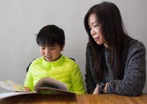Lam’s son is reading his Chinese Language textbook in Putonghua. 